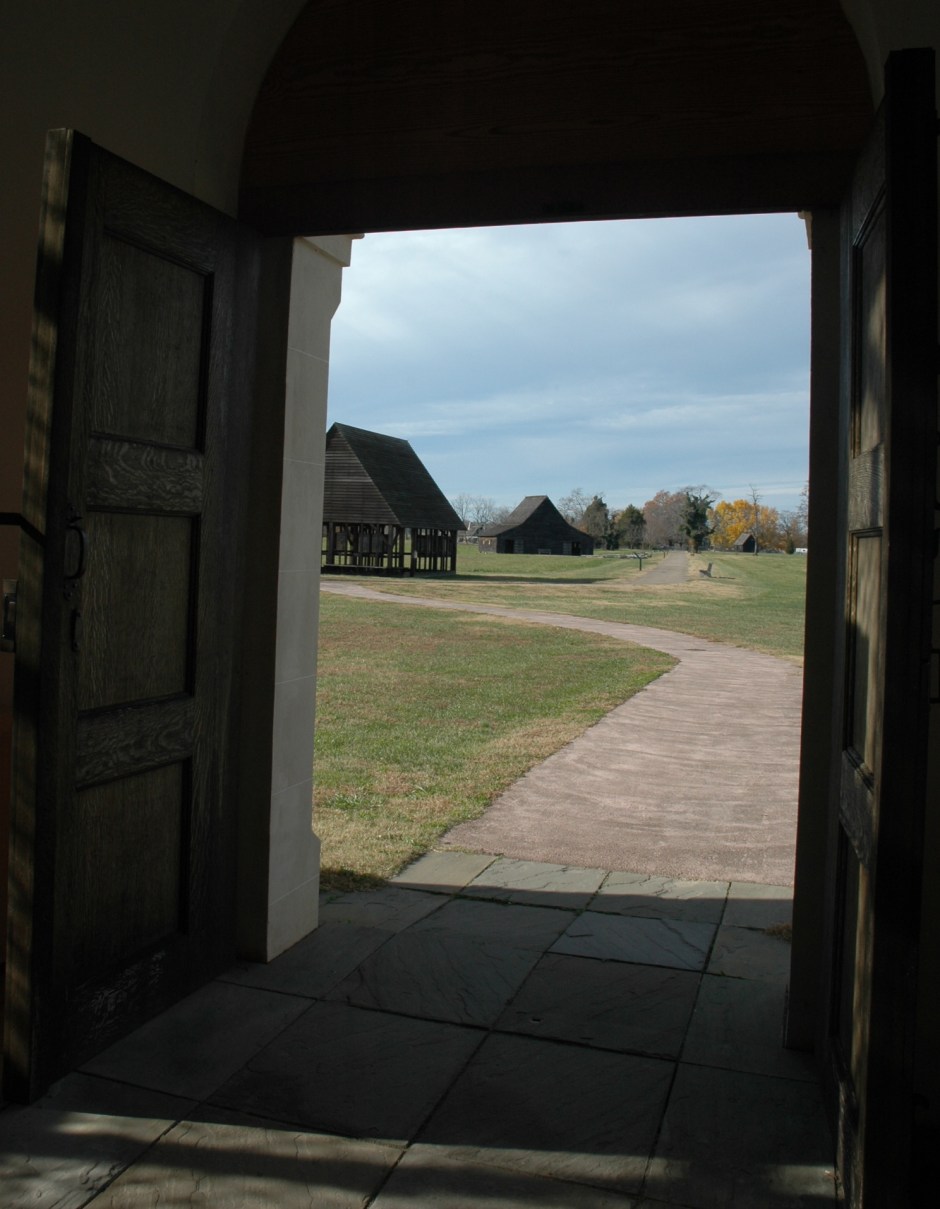 From the doorway of the reconstructed brick chapel. The structure in the background is the oldest wooden barn in Maryland. Photo: Margaret Yocom, 2013.